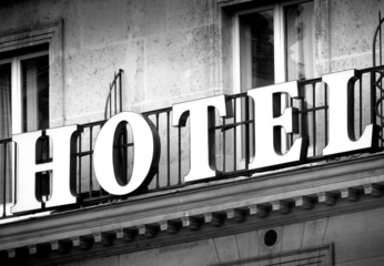 Fototapeta premium Hotel logo in black and white on a vintage building