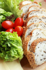 bread sprinkled with sesame -  vegetable green salad