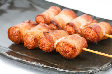 fried sausage rolled with bacon