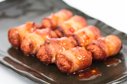 fried sausage rolled with bacon