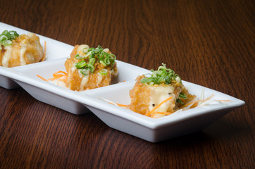 japanese cuisine. fried tofu on the background