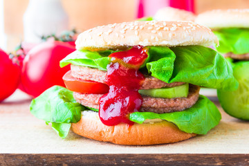 Appetizing big cheeseburger fresh lettuce cucumber