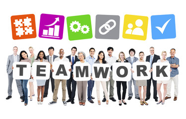 Group Of Diverse People Holding The Word Teamwork