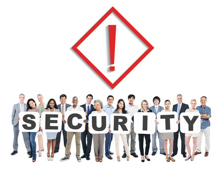 Multi-Ethnic Group Of People Holding The Word Security