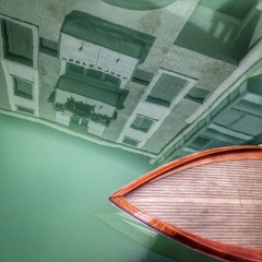 Obraz premium Venice, a wooden boat in a canal