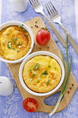 Scrambled eggs with cherry tomatoes and green onion