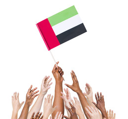 People Holding United Arab Emirates Flag