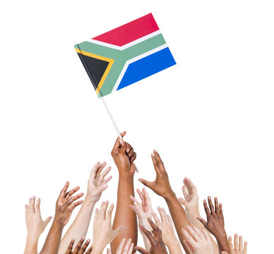 Diverse Hands Holding The South African Flag
