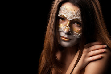 Portrait of a gentle woman with fashion make-up on black backgro