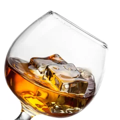 Aluminium Prints Bar Splash of whiskey with ice in glass isolated on white background