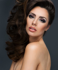 Fototapeta premium Woman with beauty long brown hair - posing at studio