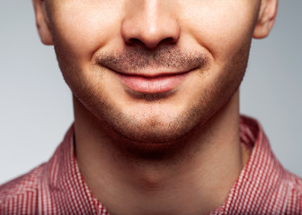 Obraz premium Charming and handsome man half face close up