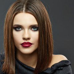 Fashion Beauty Portrait of Young Woman on Gray Background