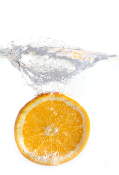 dropped orange in water isolated © coolnina