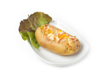 Baked potato with ham and grated cheeses