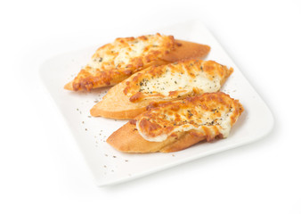 Three pieces of garlic bread topped with cheese on a white plate