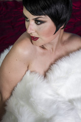 Flapper beautiful sexy brunette woman dressed in 20s style, hair
