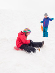 Fototapeta na wymiar small children sledging