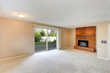 Empty living room with a brick background fireplace
