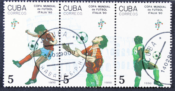 Stamp printed by CUBA shows football players.