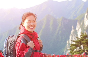 woman hiker stand at peak of mountain huashan