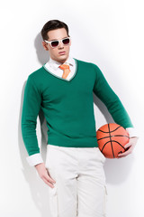Retro basketball fashion man wearing white sunglasses a green sw