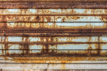 Rusty metallic gate in factory
