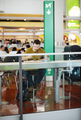 Young man at the airport is going for holiday