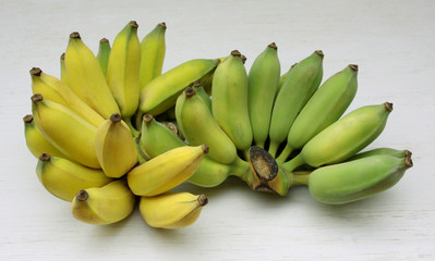 Cultivated bananas or Thai bananas on white wooden background