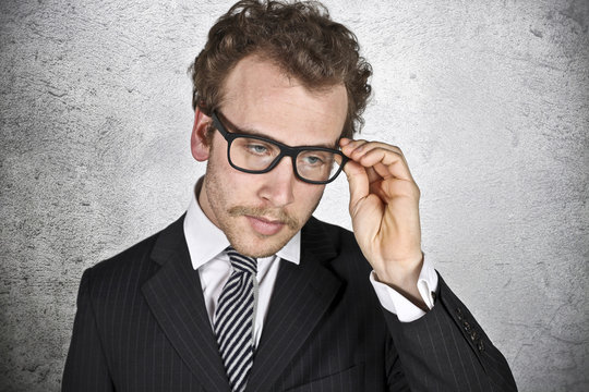 Worried Businessman With Glasses