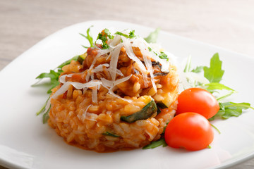 Delicious gourmet risotto with seafood, zucchinis and parsley
