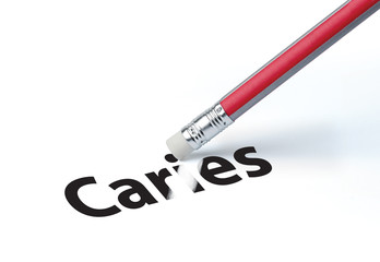 Pencil erasing the word 'Caries'