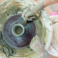 Fototapeta premium Process of making potter on a potter's wheel