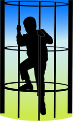 a boy climbing on the jungle gym at the park