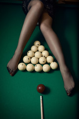 billiard ball aiming at sexy women legs in stockings