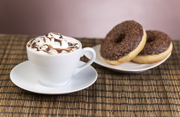 Coffee with whipped cream and croissant, donuts