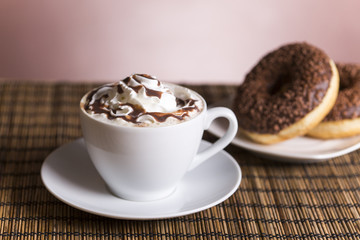 Coffee with whipped cream and croissant, donuts