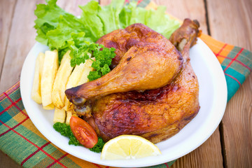 Roasted chicken legs on the plate