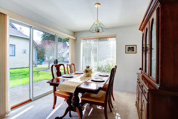 Elegant dining room with a walkout deck