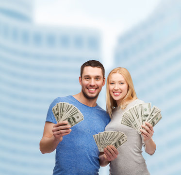 Smiling Couple Holding Dollar Cash Money