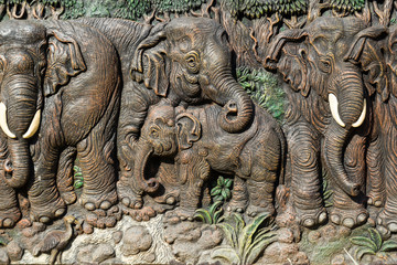 Fototapeta na wymiar Elephants carve on wood