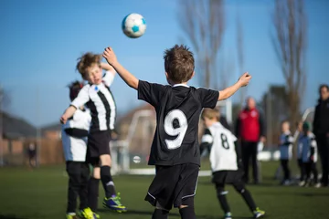 Zelfklevend Fotobehang Boys playing soccer © Mikkel Bigandt