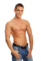 Young muscular smiling man standing poses
