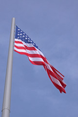 United States flag over blue sky