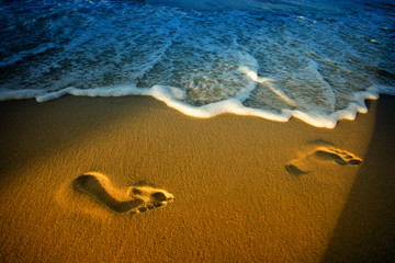 Fototapeta na wymiar Footprints on beach