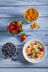 Corn flakes with fruit for breakfast