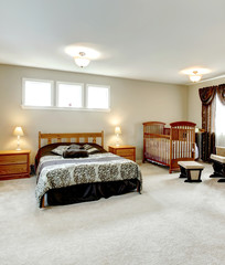 Master bedroom with a nursery area
