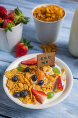 Enjoy your breakfast with cornflakes and fruits