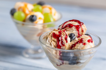Bowls with ice creams and fresh fruits
