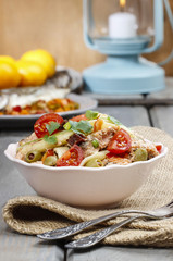 Salmon salad on wooden table